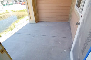 Smooth, finished concrete topping poured on an outdoor multi-family residential balcony deck.
